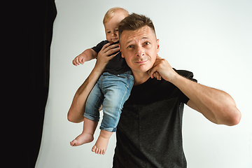 Image showing Happy father holding adorable little son and smiling