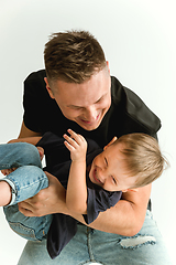 Image showing Happy father holding adorable little son and smiling