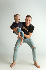 Image showing Happy father holding adorable little son and smiling