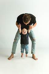 Image showing Happy father holding adorable little son and smiling