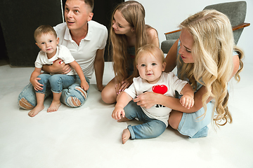 Image showing Young family spending time together and smiling