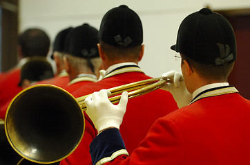 Image showing back view of musicians playing on hunting horns