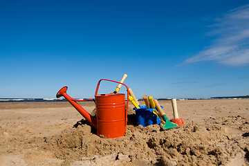Image showing Beach toys in the sandy beach