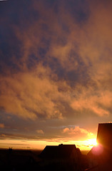 Image showing stratus clouds with orange reflection on sunset