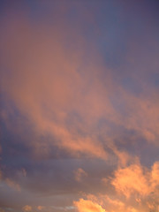 Image showing stratus clouds with orange reflection on sunset