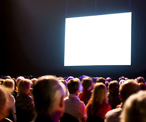 Image showing Crowd audience looking at screen