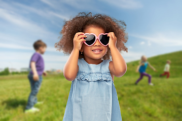 Image showing little african girl in heart shaped sunglasses