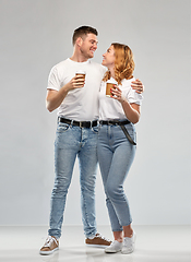 Image showing portrait of happy couple with takeaway coffee cups