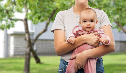 Image showing happy young mother holding little baby daughter