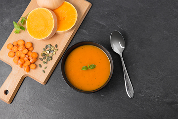 Image showing vegetable pumpkin cream soup in bowl with spoon