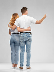 Image showing happy couple in white t-shirts hugging