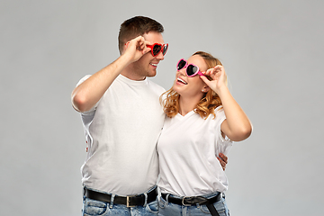 Image showing happy couple in white t-shirts and sunglasses