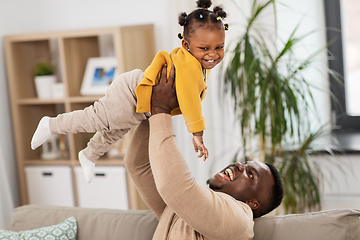 Image showing happy african american father with baby at home