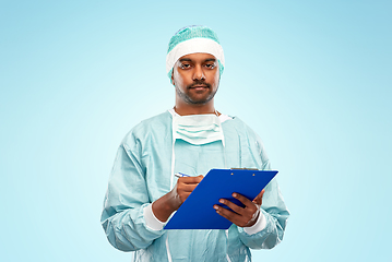 Image showing indian male doctor or surgeon with clipboard