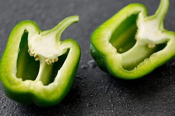 Image showing cut green pepper on slate stone background