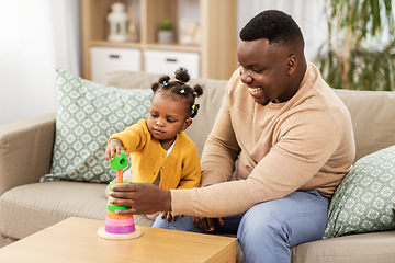 Image showing african family playing with baby daughter at home