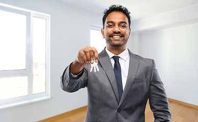 Image showing indian man realtor with home keys at new apartment