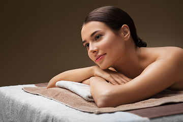 Image showing young woman lying at spa or massage parlor