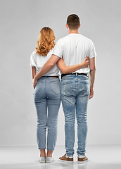 Image showing happy couple in white t-shirts hugging