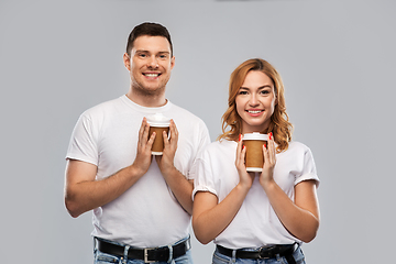 Image showing portrait of happy couple with takeaway coffee cups