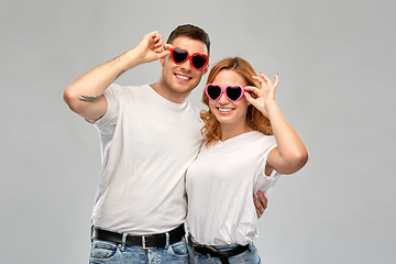 Image showing happy couple in white t-shirts and sunglasses