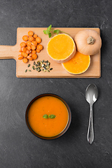 Image showing vegetable pumpkin cream soup in bowl with spoon