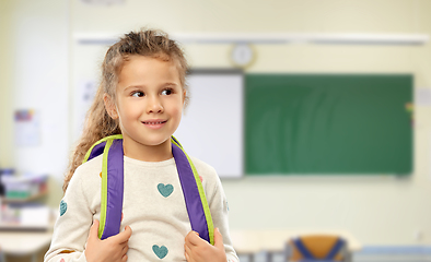 Image showing happy little girl with backpack at school