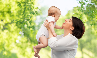 Image showing happy middle-aged mother with little baby daughter