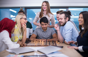 Image showing multiethnic group of business people playing chess