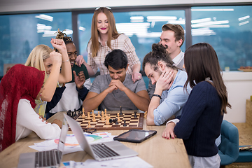 Image showing multiethnic group of business people playing chess