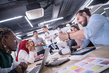 Image showing multiethnic business team learning about drone technology