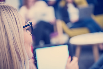 Image showing blonde businesswoman using digital tablet