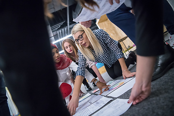 Image showing blonde businesswoman having meeting with Multiethnic  startup bu