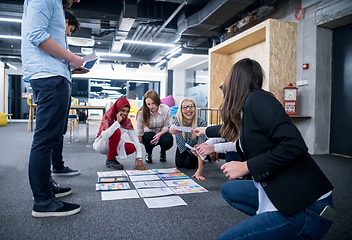 Image showing black muslim woman having meeting with Multiethnic  startup busi