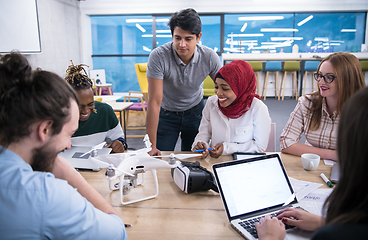 Image showing multiethnic business team learning about drone technology