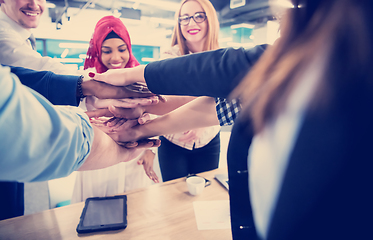 Image showing multiethnic Group of young business people celebrating success