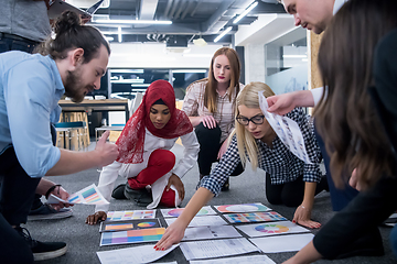 Image showing black muslim woman having meeting with Multiethnic  startup busi