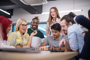 Image showing multiethnic group of business people playing chess