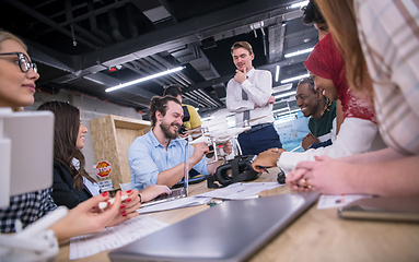 Image showing multiethnic business team learning about drone technology