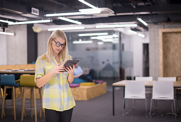 Image showing blonde businesswoman working online using digital tablet