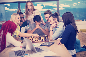 Image showing multiethnic group of business people playing chess