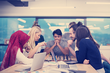 Image showing multiethnic group of business people playing chess