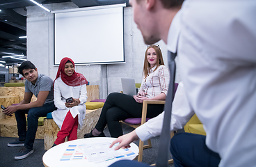 Image showing Multiethnic startup business team having meeting