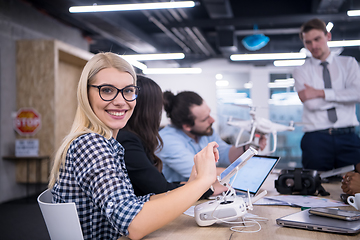 Image showing blonde business woman learning about drone technology