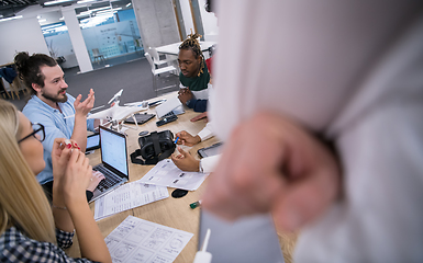 Image showing multiethnic business team learning about drone technology