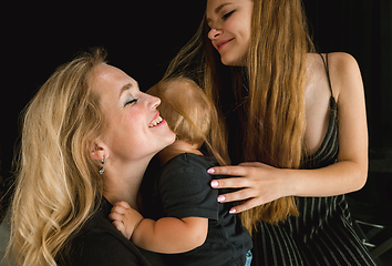 Image showing Young family spending time together and smiling