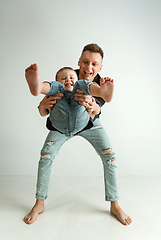 Image showing Happy father holding adorable little son and smiling