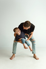 Image showing Happy father holding adorable little son and smiling