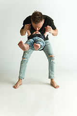 Image showing Happy father holding adorable little son and smiling