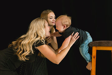 Image showing Young family spending time together and smiling